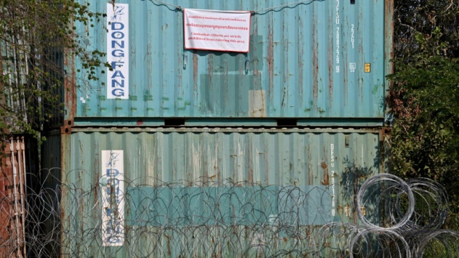 A sign hanging from a shipping container installed by Thai forces proclaims: "Cambodian citizens are strictly prohibited from entering this area"