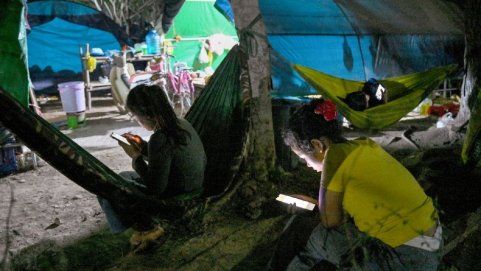 People, displaced from their homes after clashes between Thai and Cambodian soldiers, at an evacuation centre on the grounds of a pagoda in Banteay Meanchey province on February 4, 2026