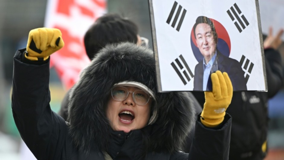 A supporter of South Korea's former president Yoon Suk Yeol in front of the Seoul Central District Court earlier this year.