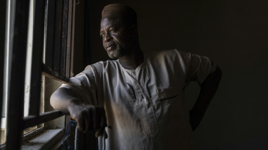 Nigerian chief Umar Bio Salihu says attackers killed scores of people and torched homes and businesses in his village, Woro