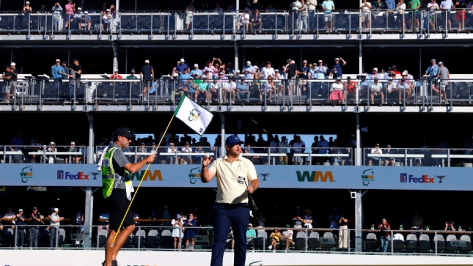 American Chris Gotterup acknowledges the crowd on the 16th green on the way to the first-round lead in the US PGA Tour Phoenix Open