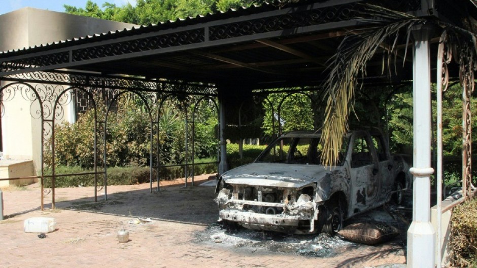 The wreckage of a car sits inside the US Embassy compound on September 12, 2012 in Benghazi, Libya, following an overnight attack on the building