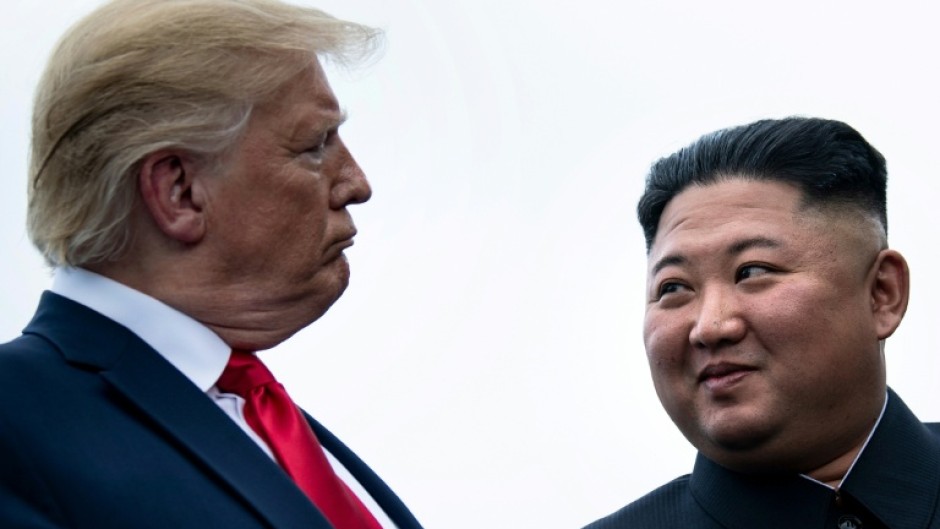 US President Donald Trump and North Korea's leader Kim Jong Un talk before a meeting in the demilitiarized zone near Panmunjom in 2019.