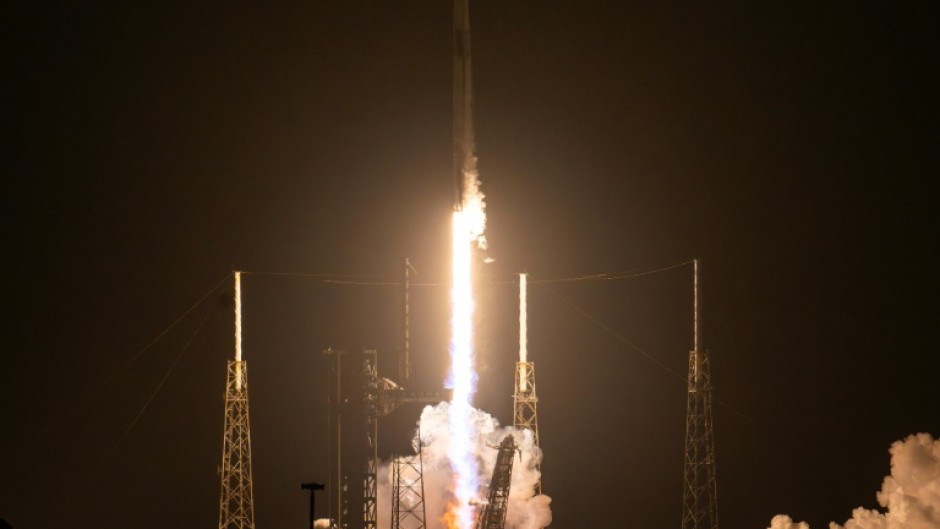 A SpaceX Falcon 9 rocket with the company's Dragon spacecraft on top launches from Cape Canaveral, en route to the International Space Station
