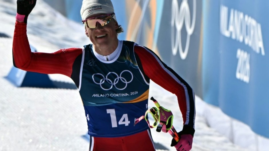 Johannes Klaebo acknowledges the crowd as the Norwegian becomes the first Winter Olympian in history to win nine gold medals