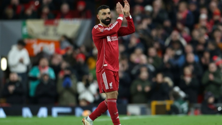 Scorer Mohamed Salah applauds Liverpool supporters after being substituted in an FA Cup victory over Brighton at Anfield.
