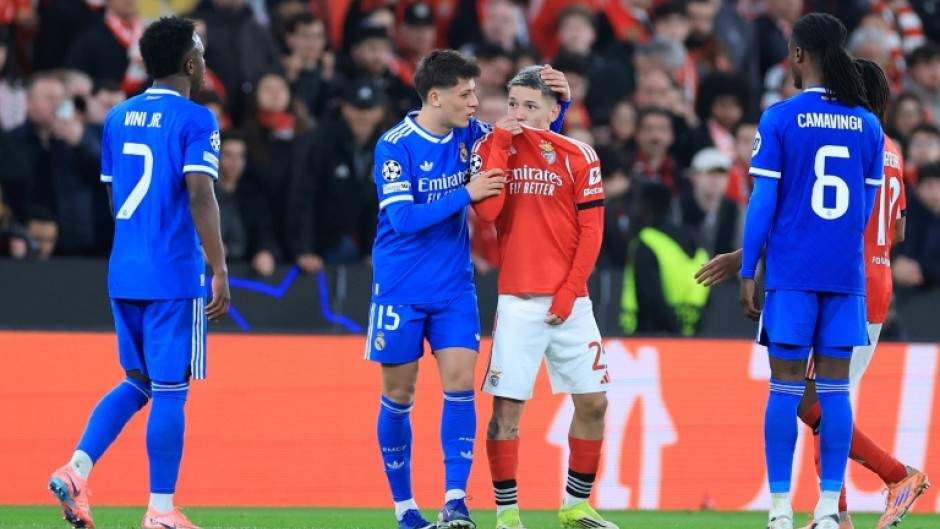 Real Madrid's Vinicius Junior (L) accused Benfica's Gianluca Prestianni (C) of calling him a 'monkey'