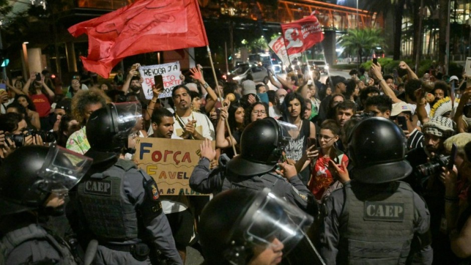Activists protest against river dredging in the Amazon outside the Sao Paulo headquarters of US agribusiness giant Cargill