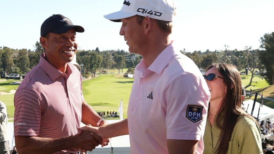 American Jacob Bridgeman is congratulated by tournament host Tiger Woods after winning the PGA Tour Genesis Invitational at Riviera Country Club