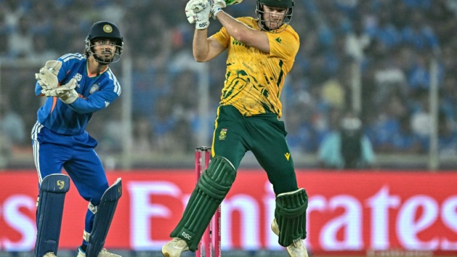 David Miller plays a shot as India wicketkeeper Ishan Kishan watches