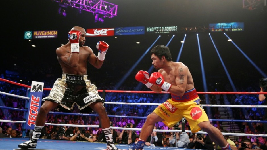 Floyd Mayweather (left) beat Manny Pacquiao in their 2015 'Fight of the Century' in Las Vegas