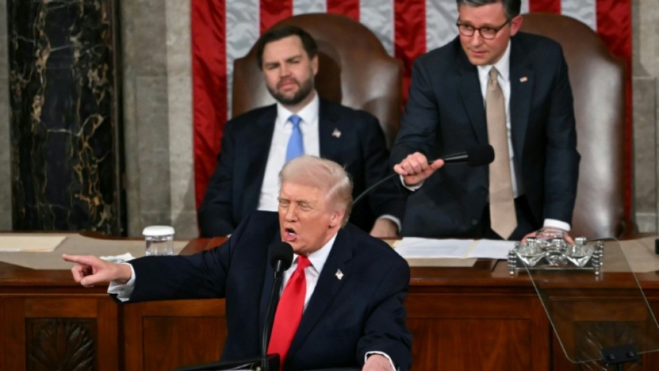 US President Donald Trump gestures toward Democratic members of Congress as he delivers the State of the Union address in the House Chamber of the US Capitol in Washington, DC, on February 24, 2026