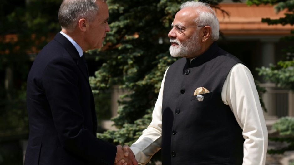 Canadian Prime Minister Mark Carney greets Indian Prime Minister Narendra Modi at a G7 meeting last year in western Canada