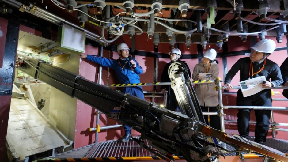 The snake-like robot arm measures 22 metres and weighs about 4.6 tonnes