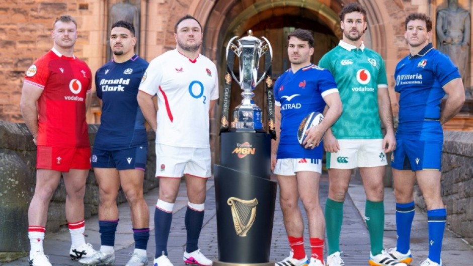 Wales' Dewi Lake, Scotland's Sione Tuipulotu, England's Jamie George, France's Antoine Dupont, Ireland's Caelan Doris, and Italy's Michele Lamaro pose with the trophy in January before the accident