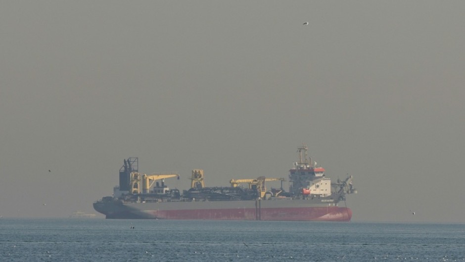 Qatar's state-run energy firm said it had halted liquefied natural gas production following Iranian attacks on facilities at two of its main gas processing bases