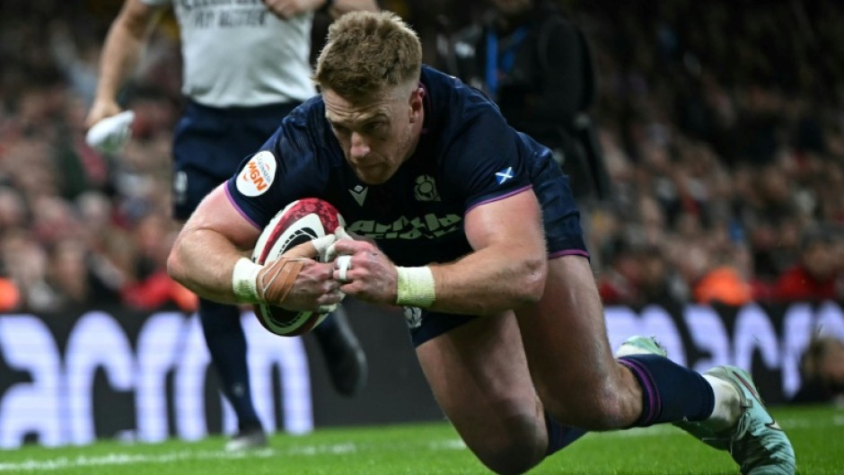 Scotland wing Kyle Steyn dives over the line to score a try during a 26-23 Six Nations win away to Wales in Cardiff