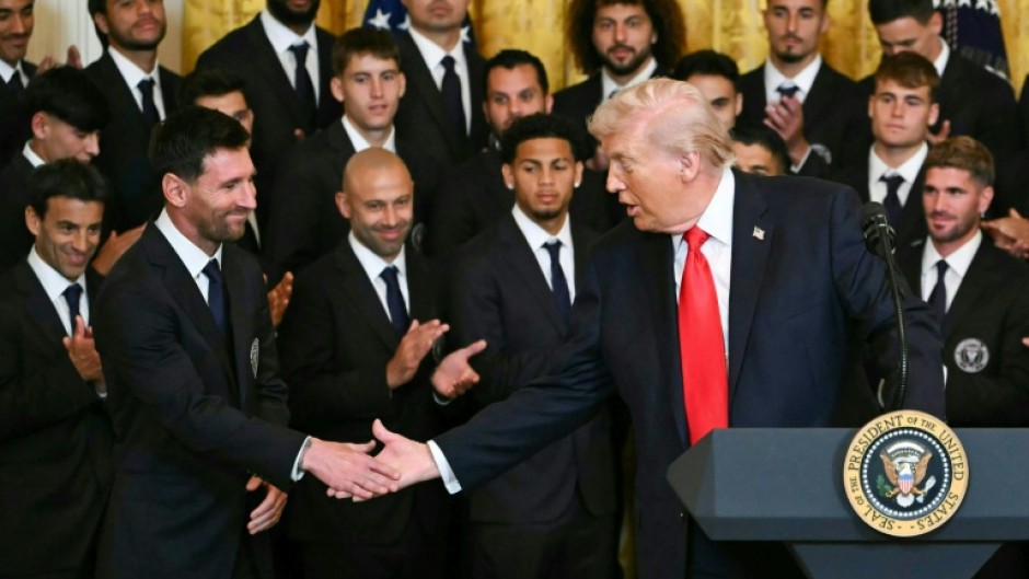 US President Donald Trump shakes hands with Inter Miami's Argentinian star Lionel Messi at an event honoring the club's 2025 MLS Cup title