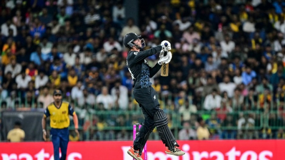 New Zealand's captain Mitchell Santner plays a shot at the World Cup