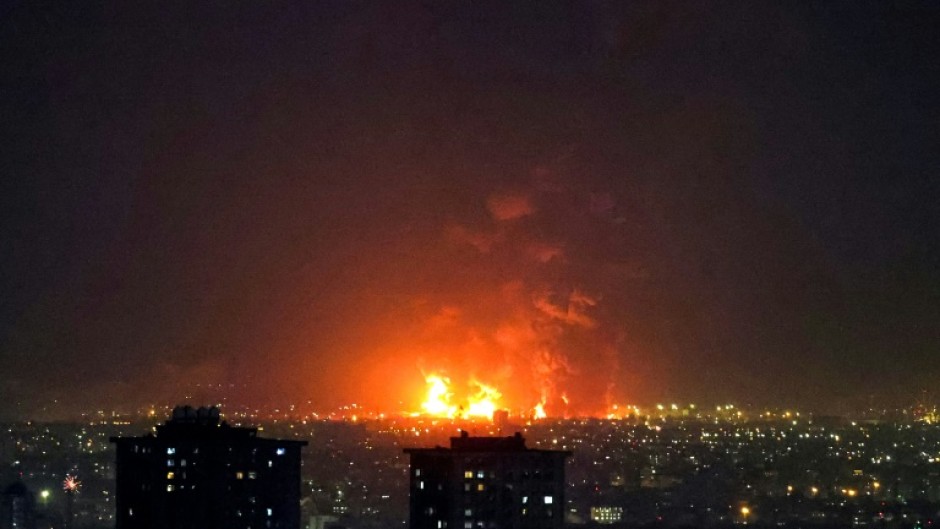 Fire lights up the sky in Tehran as Iranian oil refineries are hit during the US-Israeli campaign