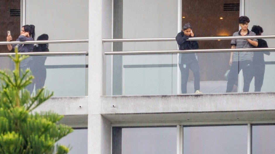 Members of the Iranian women’s football team are seen on their respective room balconies at the Royal Pines Resort on the Gold Coast on March 9, 2026