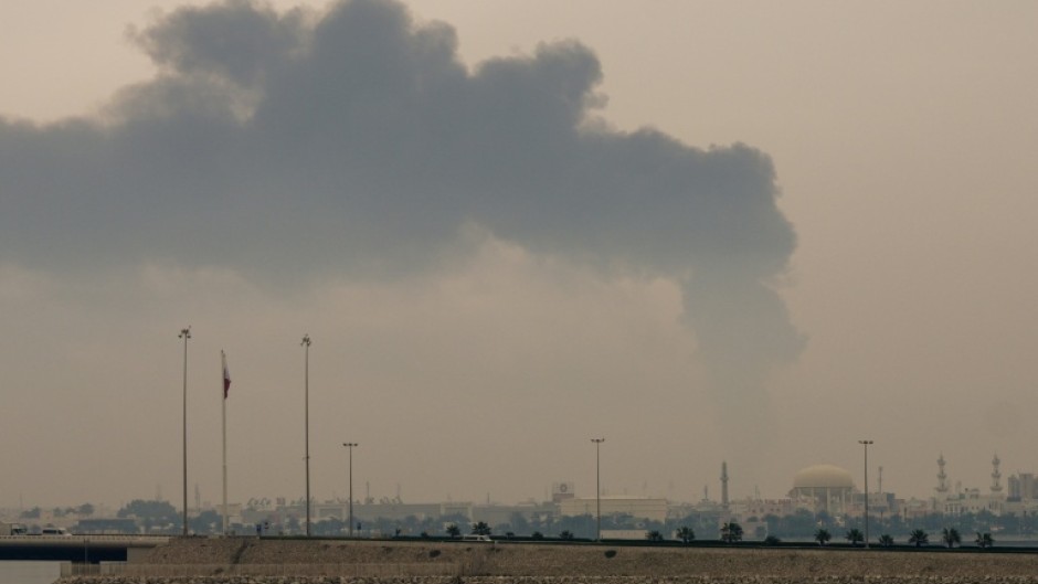 A plume of smoke rises after a reported Iranian strike on fuel tanks in Bahrain