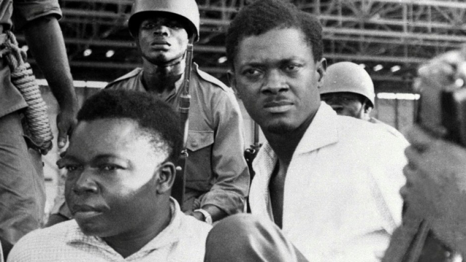 Patrice Lumumba (R) and Senate vice-president Joseph Okito (L) after their arrest in Leopoldville (now Kinshasa) in 1960