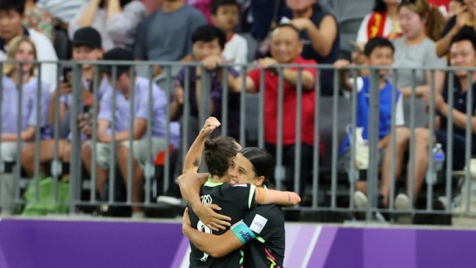 Australia's Sam Kerr (R) Caitlin Foord celebrate a goal during their Women’s Asian Cup semi-final win over China