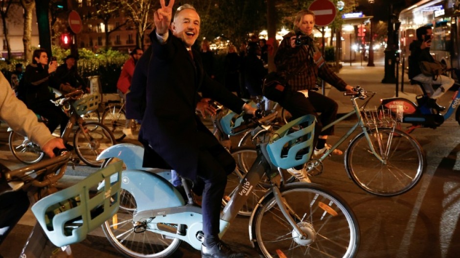 Socialist candidate Emmanuel Gregoire hopped on one of Paris's iconic rental bikes to head to city hall