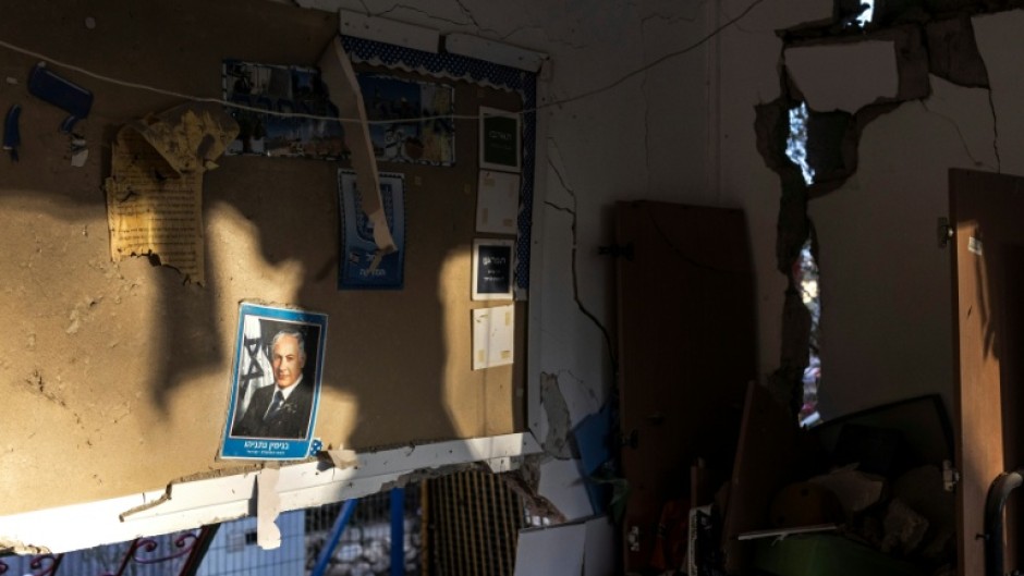 A portrait of Israeli Prime Minister Benjamin Netanyahu on the wall of a kindergarten damaged in an Iranian missile strike in Dimona on March 22