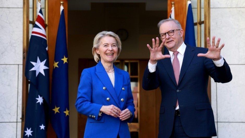 Australian Prime Minister Anthony Albanese (R) welcomes European Commission President Ursula von der Leyen for talks at Parliament House in Canberra on March 24, 2026