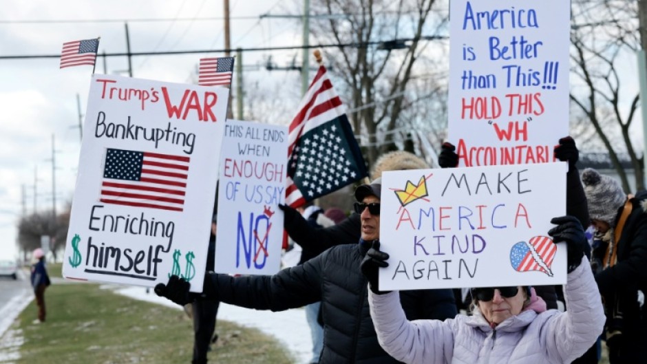 Demonstrators take part in the 'No Kings' national day of protest in West Bloomfield, Michigan, a suburb of Detroit