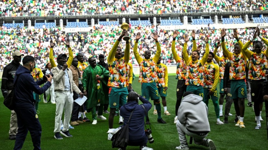 Senegal's players performed a lap of honour with the Africa Cup of Nations trophy