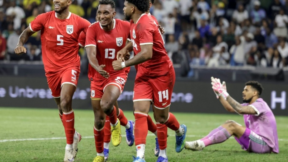 Jiovany Ramos (2L) celebrates after scoring the winner for Panama against South Africa in Cape Town.