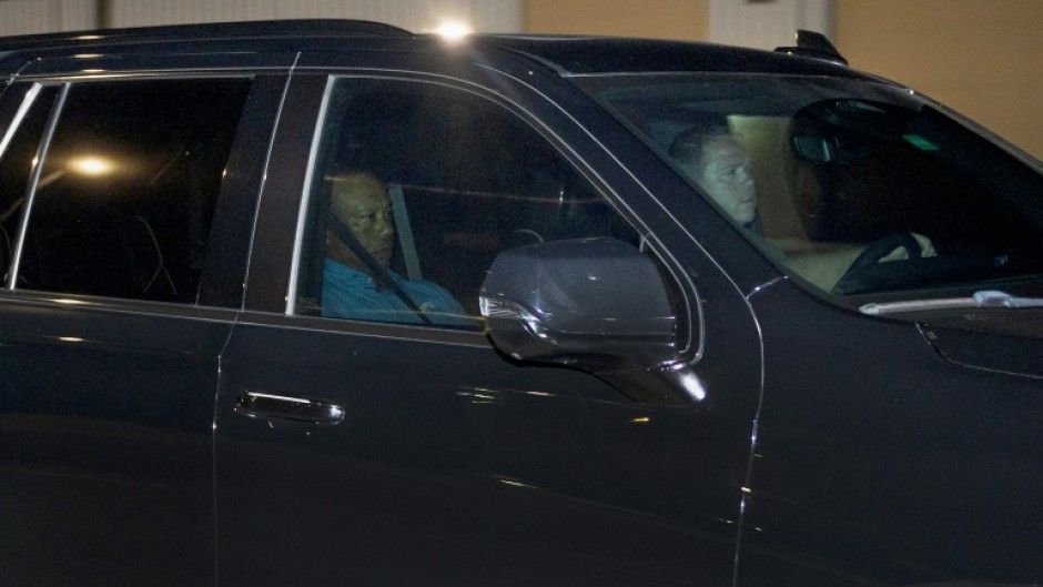 Tiger Woods is driven from the Martin County Jail after being arrested for driving under the influence after a car crash