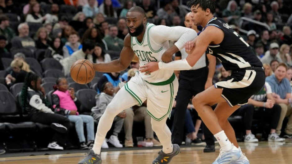 Boston Celtics star Jaylen Brown drives past Ousmane Dieng in the Celtics' NBA victory over the Milwaukee Bucks