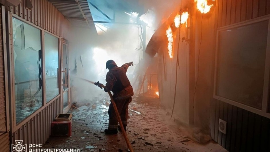 Ukraine's State Emergency Service released images of its firefighters at the scene of the strike on the market in Nikopol