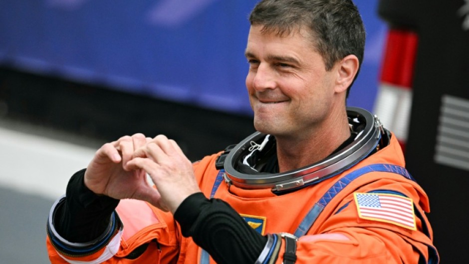 NASA astronaut Reid Wiseman gestured a heart sign before the Artemis II took off to orbit the Moon, where astronauts proposed for a crater to be named "Carroll" in honor of his deceased wife