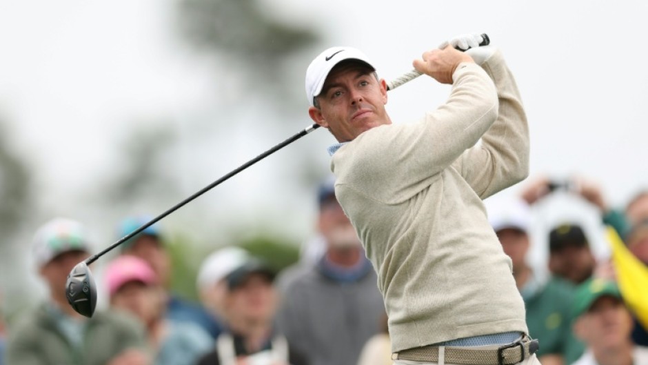 Defending champion and world number two Rory McIlroy of Northern Ireland plays a tee shot during a practice round for the 90th Masters at firm and fast Augusta National