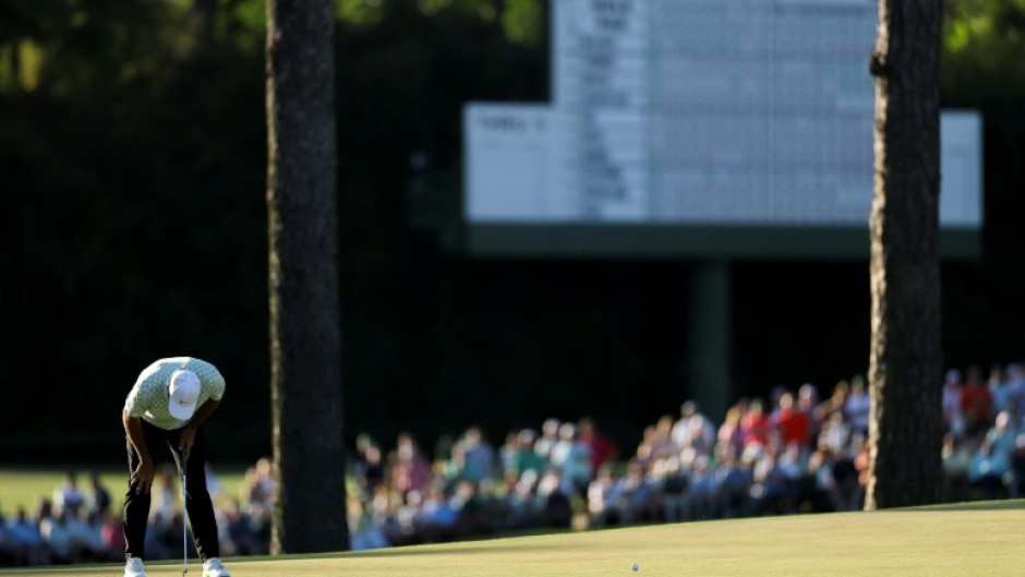 World number one Scottie Scheffler reacts after a missed putt on the 15th green during the first round of the 90th Masters