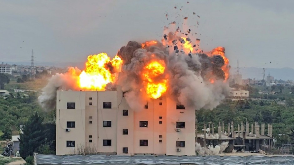 An Israeli airstike hits a building in Lebanon, in the southern village of Abbasiyyeh, on March 13
