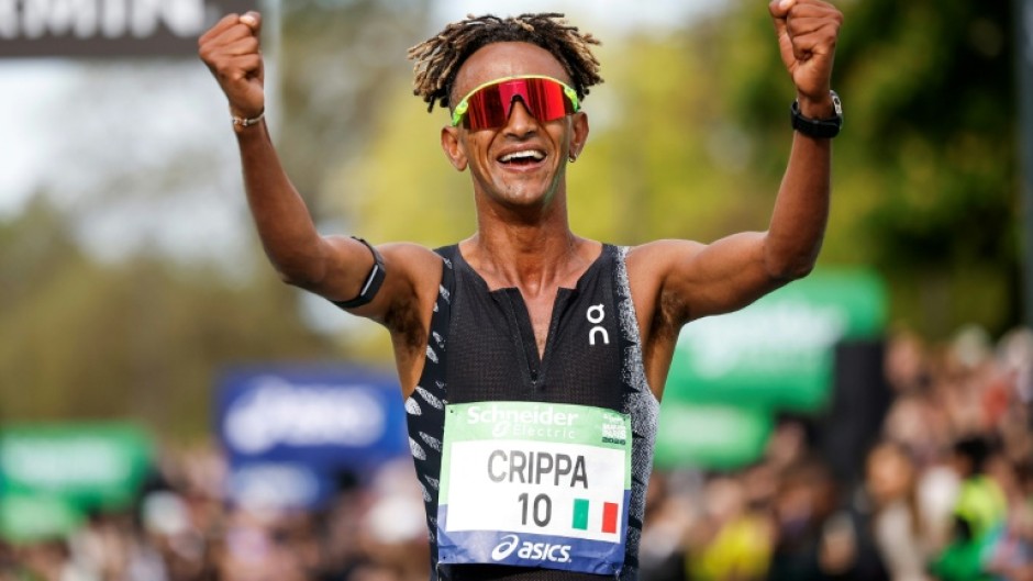 Italy's Yemaneberhan Crippa celebrates after winning the Paris marathon