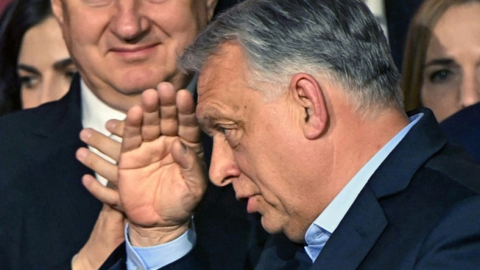 Hungary's Prime Minister Viktor Orban salutes to supporters at the Balna centre in Budapest during a general election in Hungary, on April 12, 2026