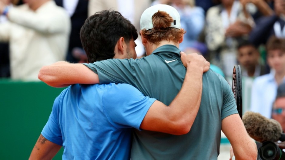 Spain's Carlos Alcaraz (L) lost the world number one spot to great rival Jannik Sinner (R) after the Italian beat him in the final of the Monte Carlo Masters