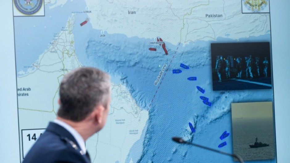 US Chairman of the Joint Chiefs of Staff General Dan Caine shows a map of the Strait of Hormuz at a Pentagon press briefing