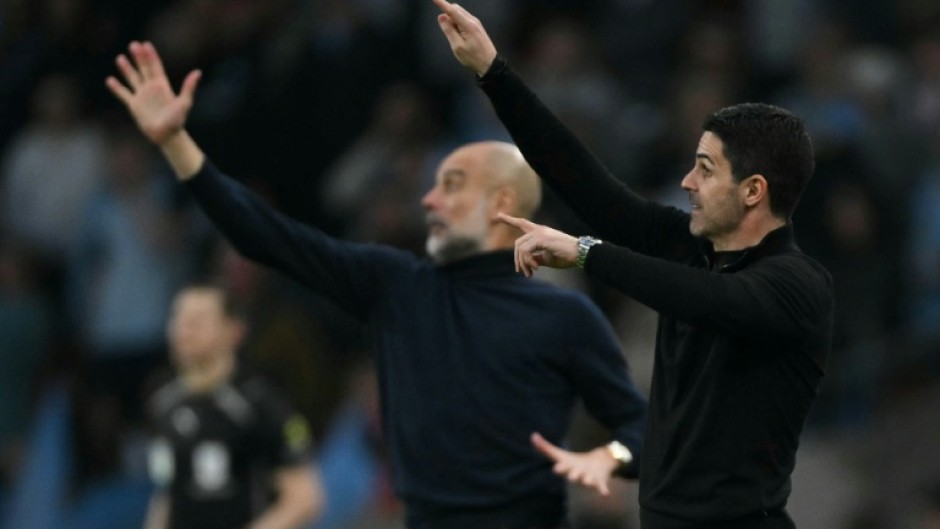 Pep Guardiola's (L) Manchester City are trying to usurp Mikel Arteta's (R) Arsenal at the top of the Premier League