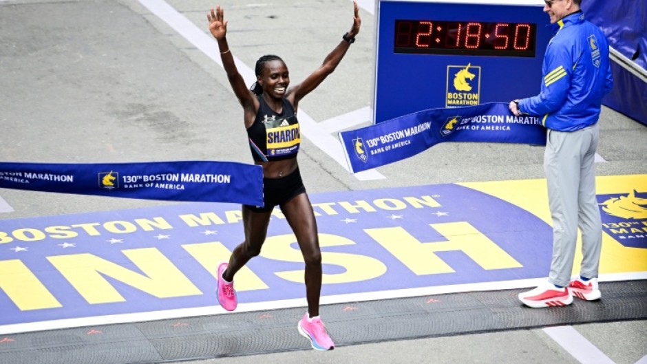 Kenya's Sharon Lokedi celebrates defending her Boston Marathon title