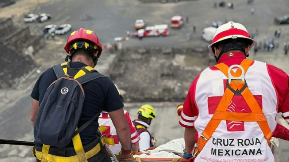 This handout picture released by the Mexican Red Cross shows the removal of the body of a Canadian woman who was shot dead at Teotihuacan by a man who later killed himself