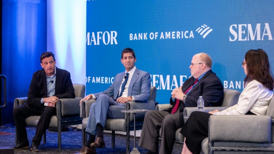 Federal Reserve Chair nominee Kevin Warsh (second from left) will be closely watched at an upcoming Senate confirmation hearing to see how aligned he is with President Donald Trump on cutting interest rates