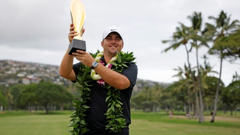Chris Gotterup celebrates with the trophy after winning this year's Sony Open. The PGA Tour is now scrapping its season-opening swing in Hawaii